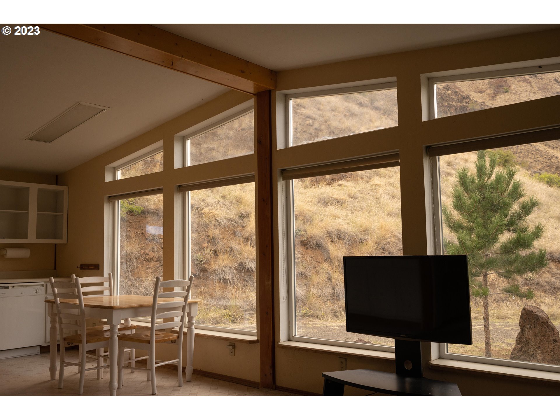 74234 Lower Imnaha Road Imnaha, OR 97842 - Photo 12 of 33 a living room with large windows