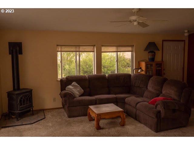74234 Lower Imnaha Road Imnaha, OR 97842 - Photo 14 of 33 a living room with furniture and a flat screen tv