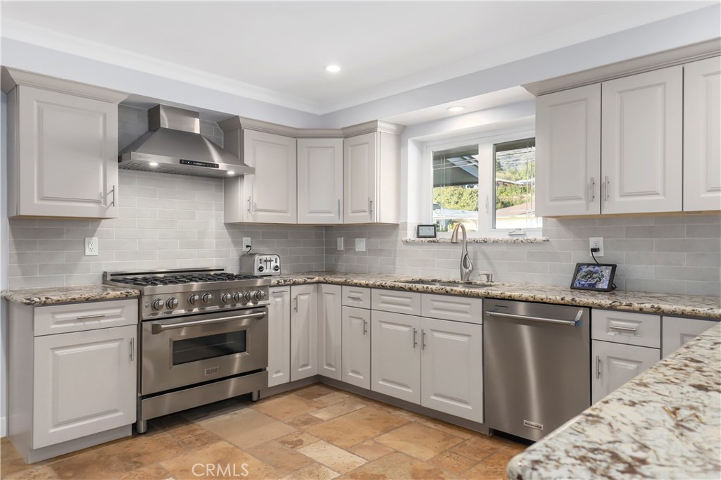 3810 Startouch Drive Pasadena, CA 91107 - Photo 11 of 53 a kitchen with sink stove and cabinets