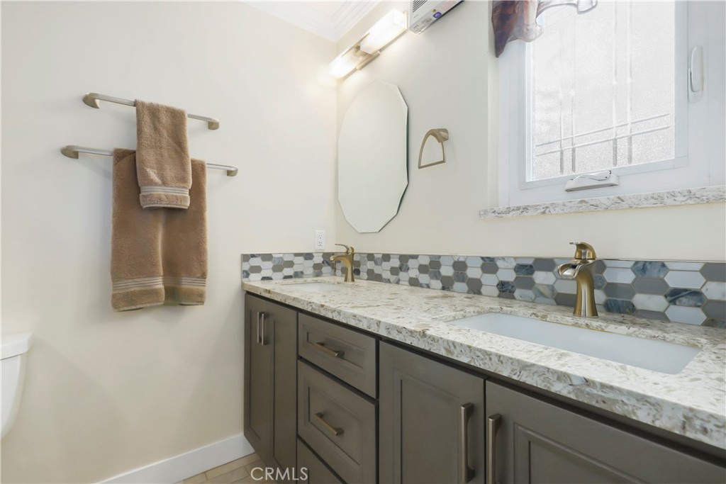 3810 Startouch Drive Pasadena, CA 91107 - Photo 23 of 53 a bathroom with a granite countertop sink and a mirror