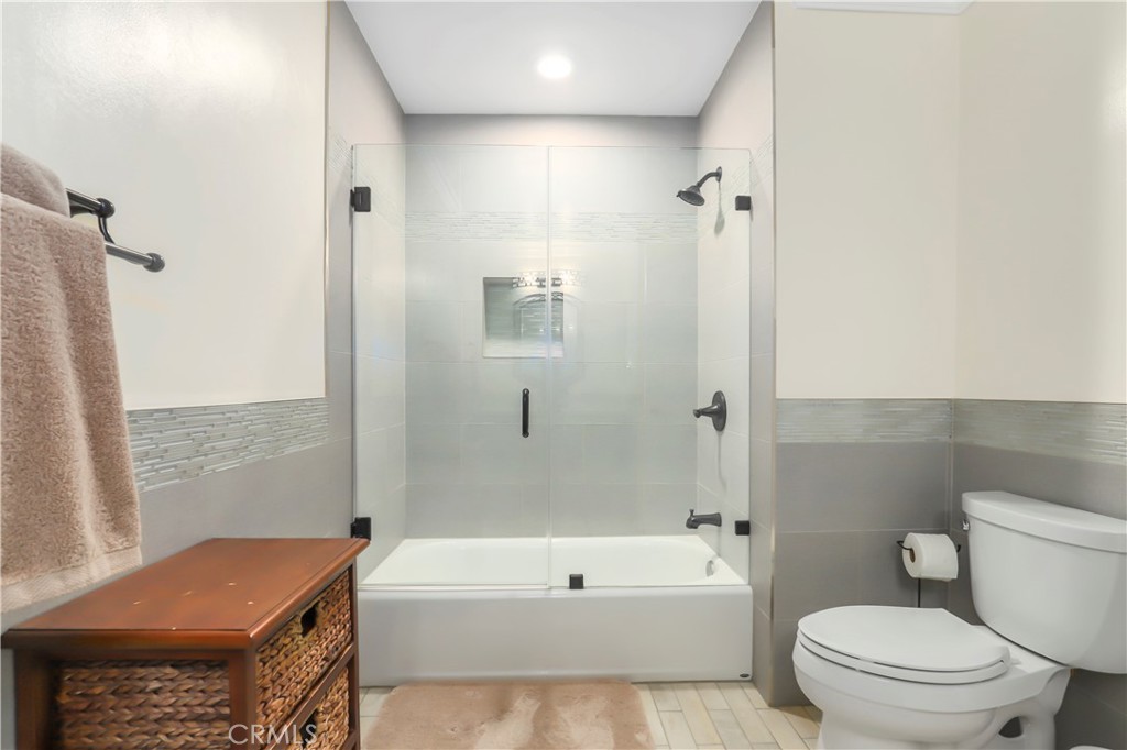 3810 Startouch Drive Pasadena, CA 91107 - Photo 30 of 53 a bathroom with a granite countertop bathtub shower sink vanity and toilet