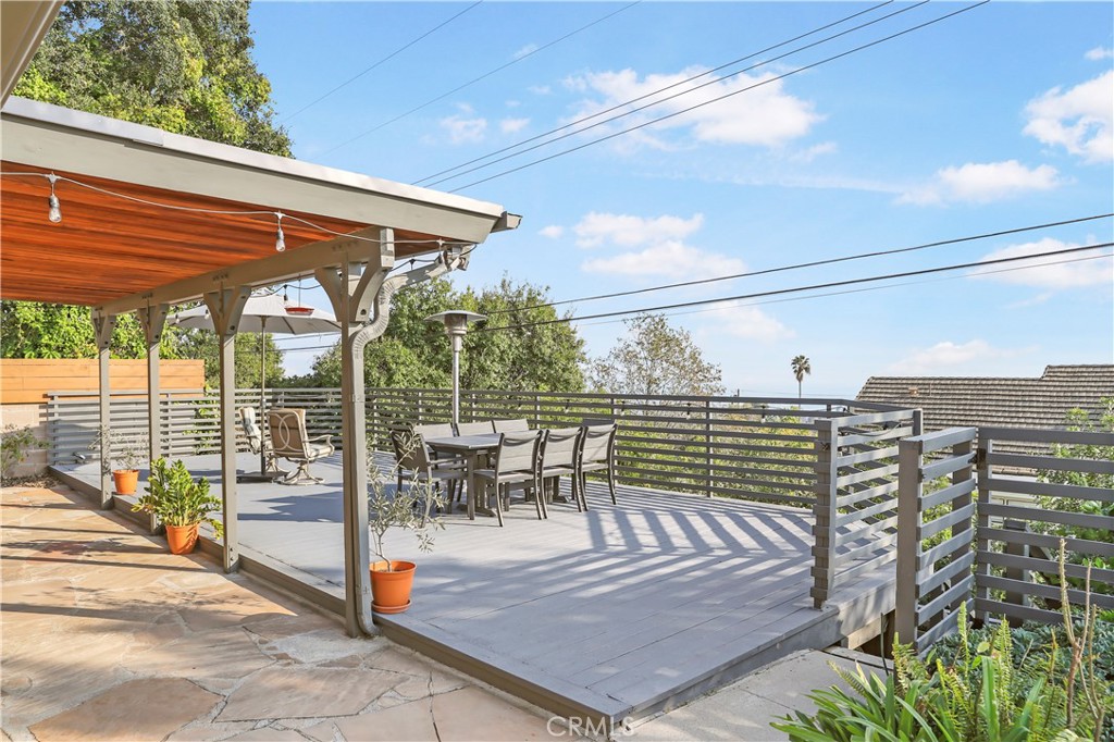 3810 Startouch Drive Pasadena, CA 91107 - Photo 42 of 53 a view of a patio with a dining table and chairs with wooden floor