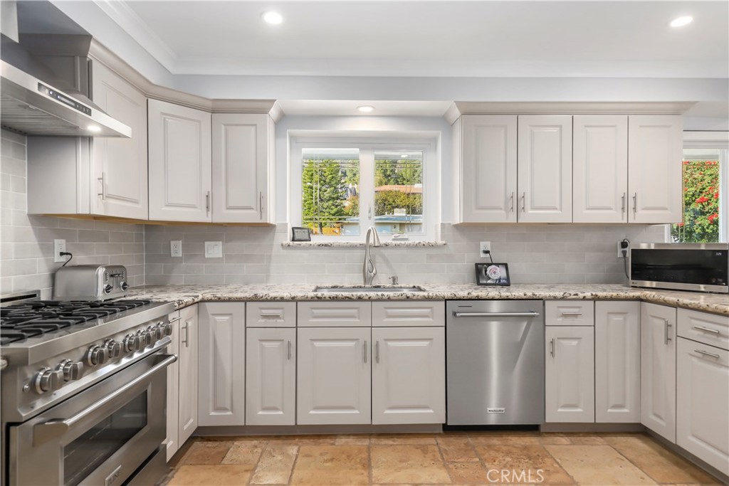 3810 Startouch Drive Pasadena, CA 91107 - Photo 10 of 53 a kitchen with white cabinets appliances and window