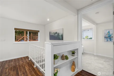 a view of an entryway with wooden floor