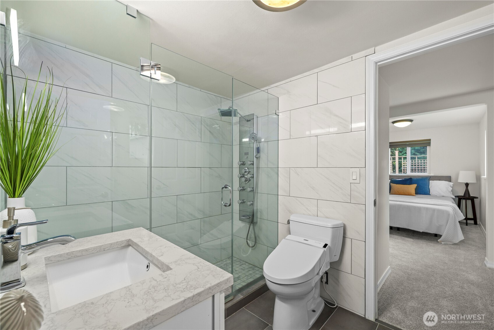 15245 Fremont Avenue North Shoreline, WA 98133 - Photo 13 of 28 a bathroom with a sink a toilet and shower