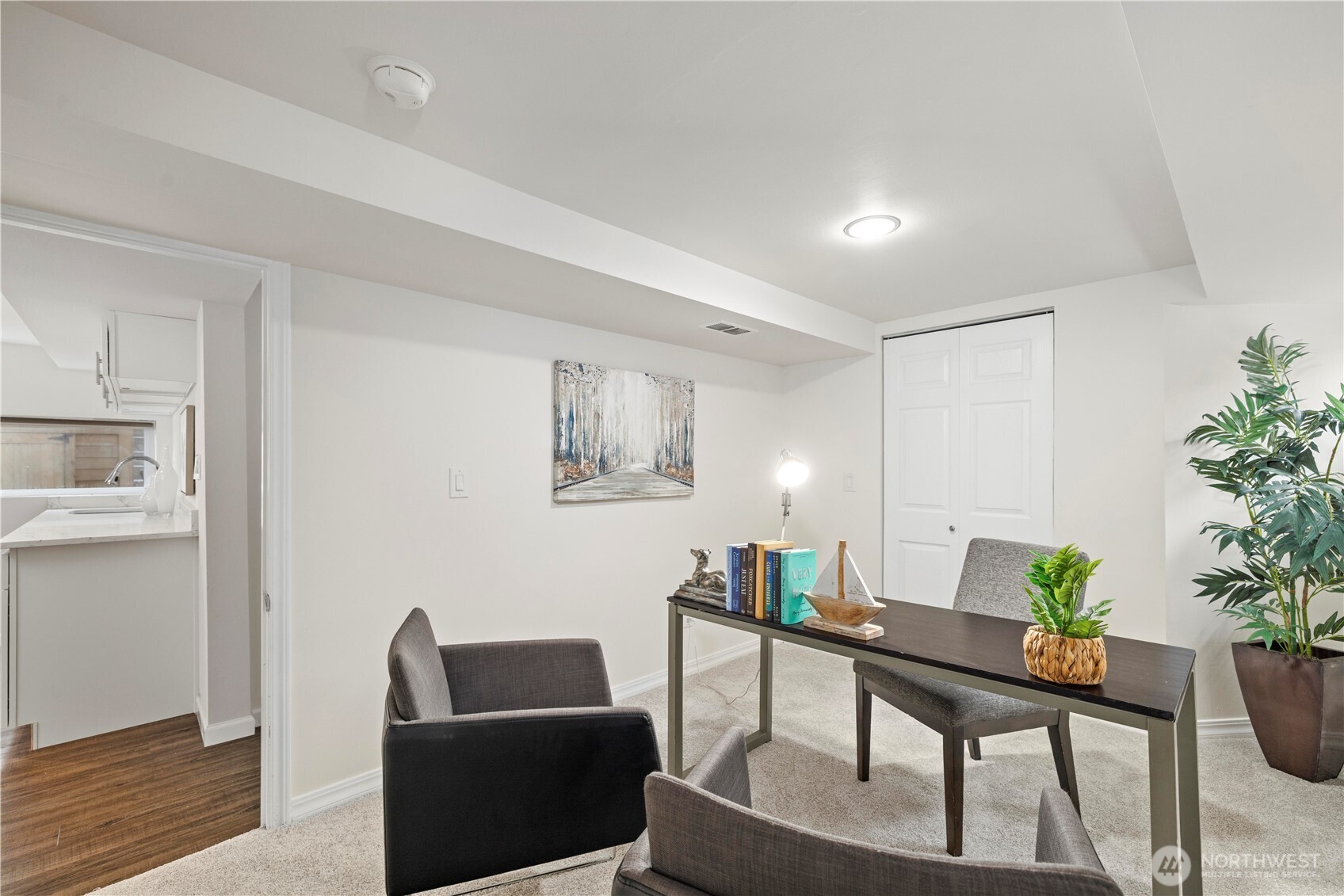 15245 Fremont Avenue North Shoreline, WA 98133 - Photo 20 of 28 a living room with furniture and a potted plant
