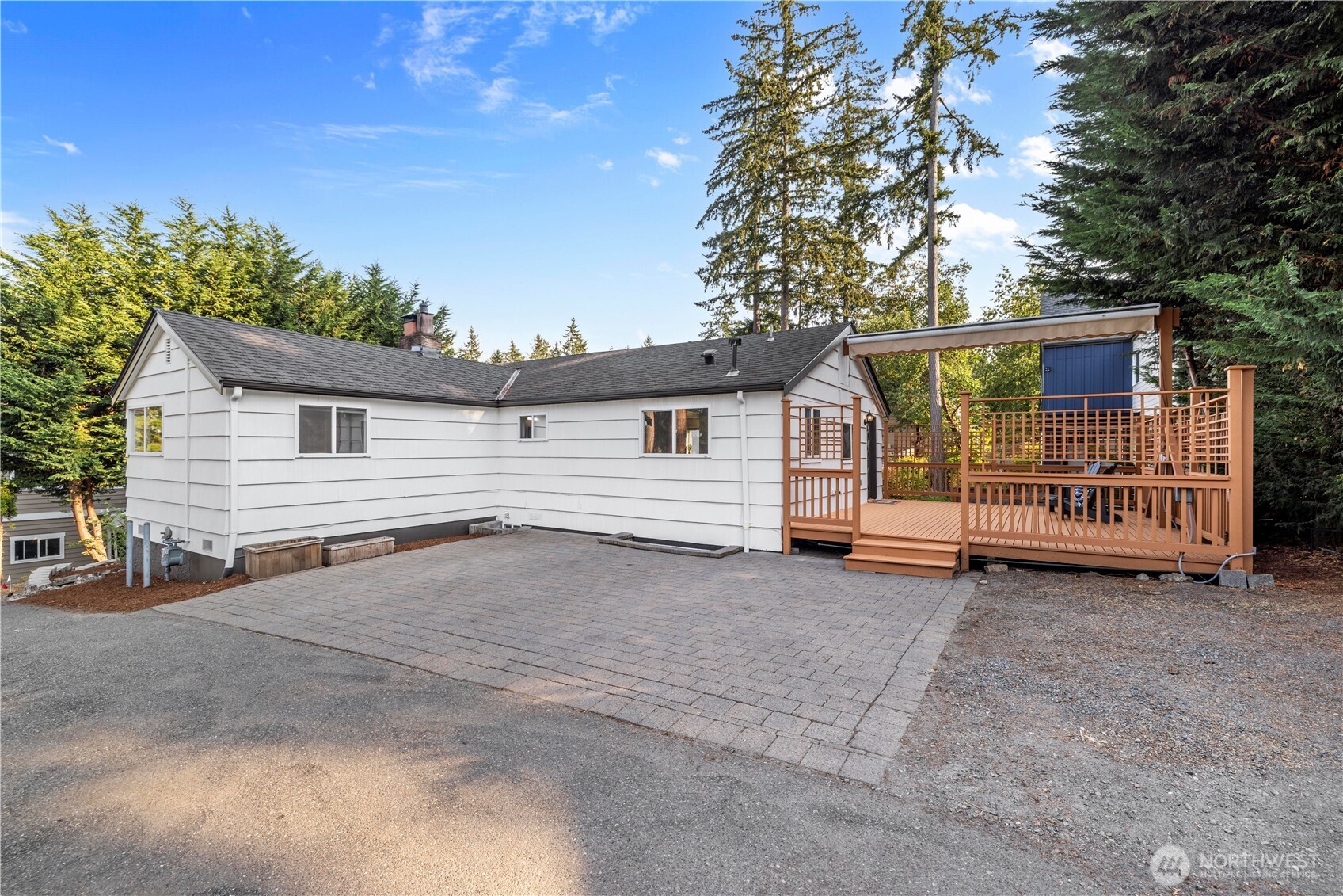 15245 Fremont Avenue North Shoreline, WA 98133 - Photo 24 of 28 a view of a house with a yard