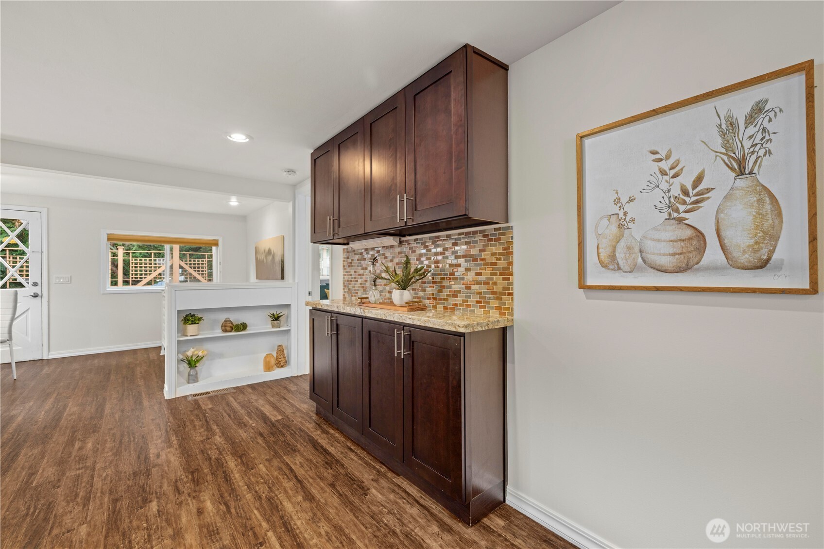 15245 Fremont Avenue North Shoreline, WA 98133 - Photo 7 of 28 a kitchen with a wooden floor and a stove top oven