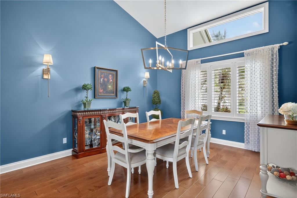 6 Bramblewood Point Naples, FL 34105 - Photo 13 of 47 a view of a dining room with furniture window and wooden floor