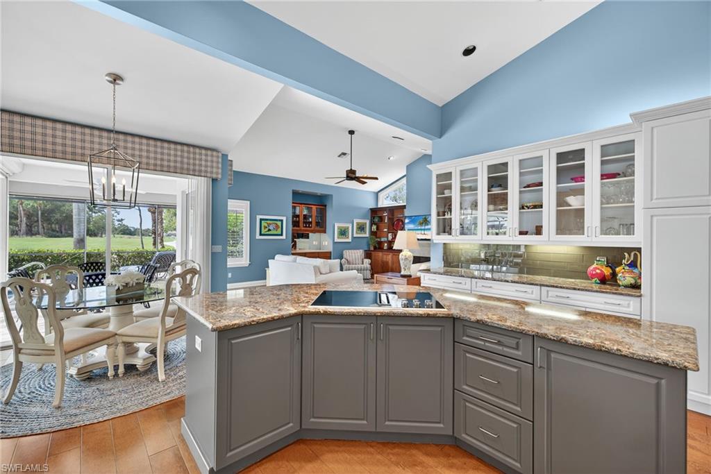 6 Bramblewood Point Naples, FL 34105 - Photo 16 of 47 a kitchen with sink and view of living room