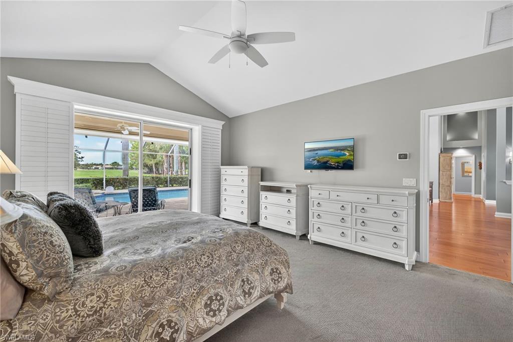 6 Bramblewood Point Naples, FL 34105 - Photo 21 of 47 a bedroom with a bed dresser and a window
