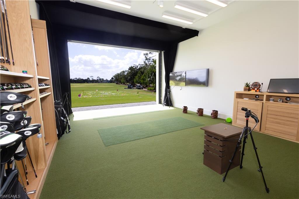 6 Bramblewood Point Naples, FL 34105 - Photo 40 of 47 a living room with furniture and a floor to ceiling window