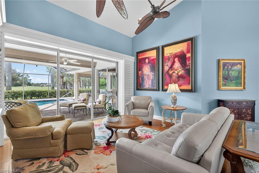 6 Bramblewood Point Naples, FL 34105 - Photo 6 of 47 a living room with furniture and a large window