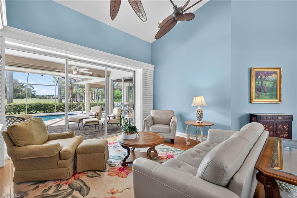 6 Bramblewood Point Naples, FL 34105 - Photo 7 of 47 a living room with furniture and a large window