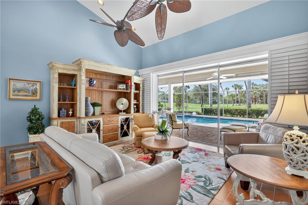 6 Bramblewood Point Naples, FL 34105 - Photo 8 of 47 a living room with furniture and a large window