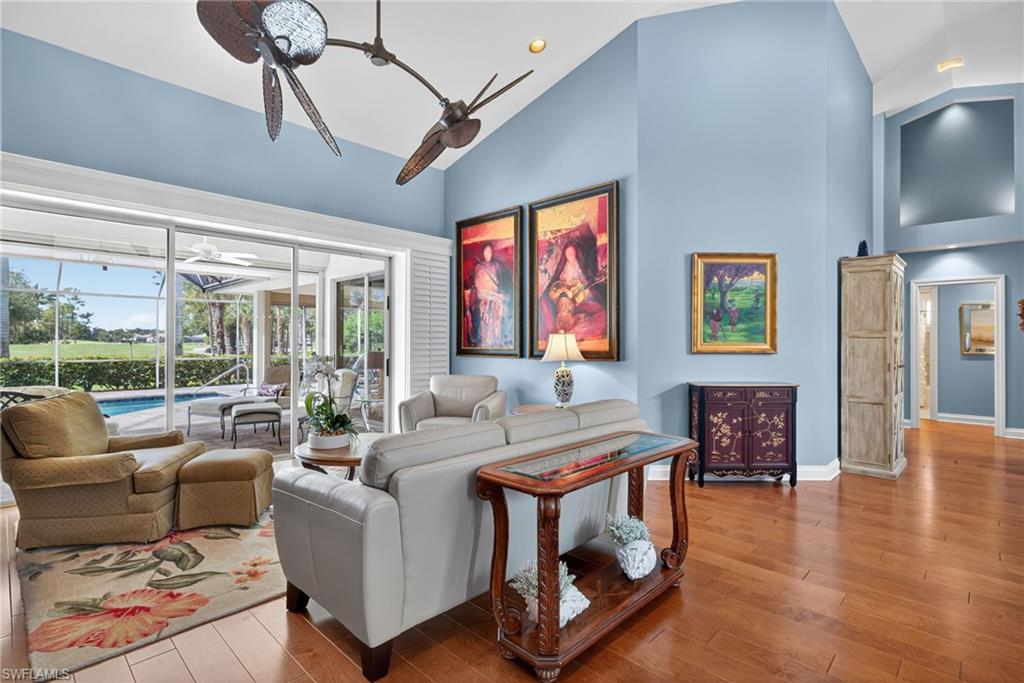 6 Bramblewood Point Naples, FL 34105 - Photo 9 of 47 a living room with furniture and a flat screen tv