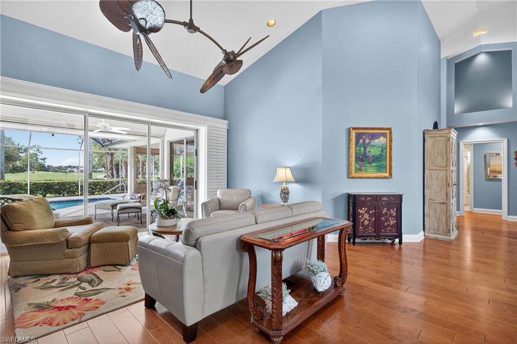 6 Bramblewood Point Naples, FL 34105 - Photo 10 of 47 a living room with furniture and a fireplace