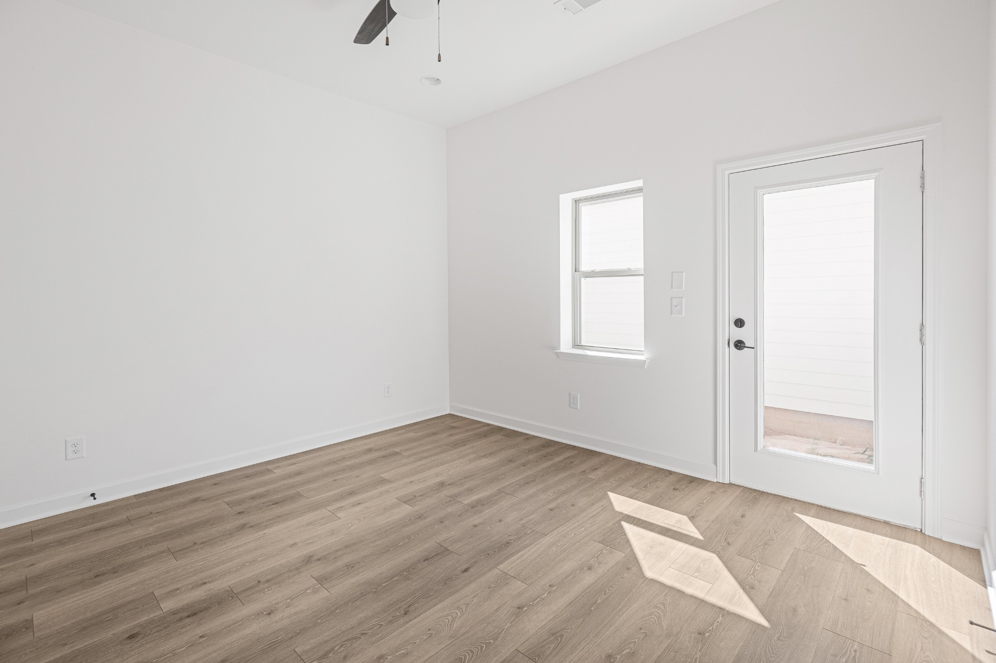 361 A Wellows Chase Spring Hill, TN 37174 - Photo 13 of 25 an empty room with wooden floor and windows