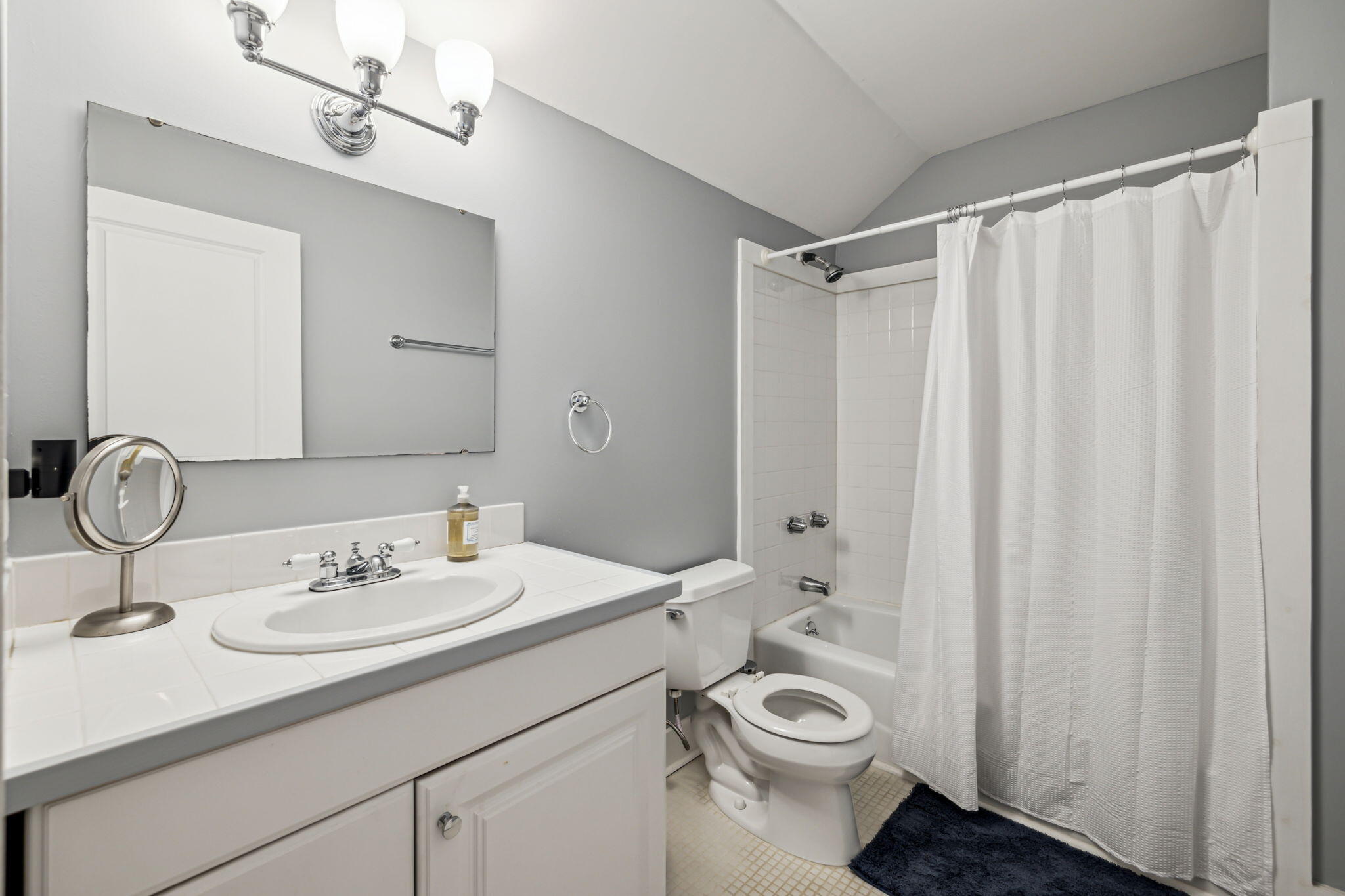 214 Chrysler Avenue Santa Rosa Beach, FL 32459 - Photo 28 of 53 a bathroom with a sink a toilet and shower curtain