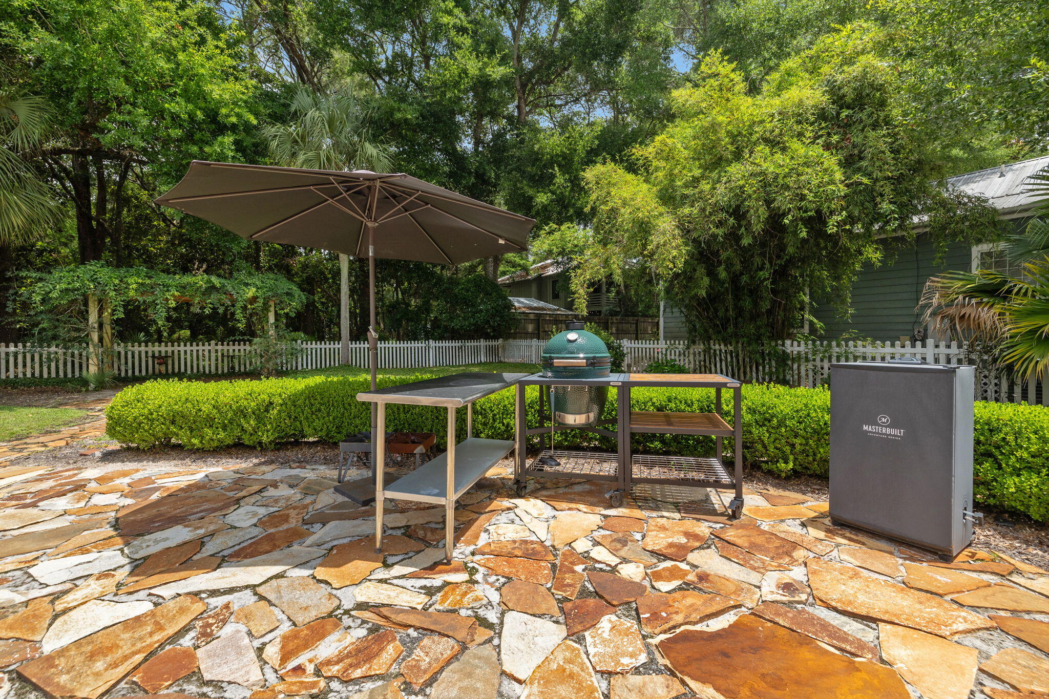 214 Chrysler Avenue Santa Rosa Beach, FL 32459 - Photo 39 of 53 a view of a chair and table with umbrella in the backyard
