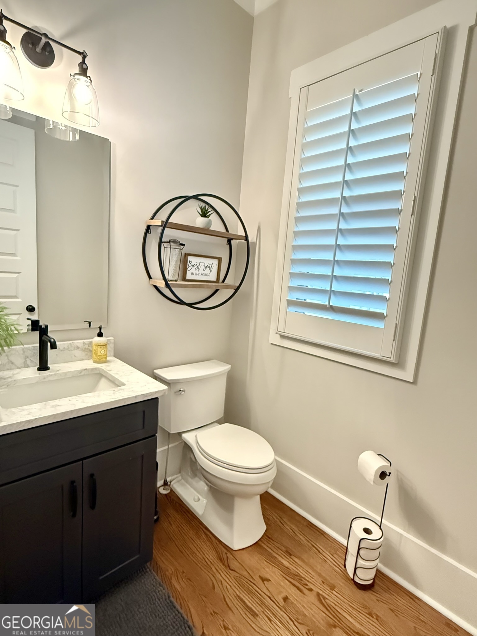 120 Spring Creek Drive Rutledge, GA 30663 - Photo 17 of 38 a bathroom with a toilet sink and mirror