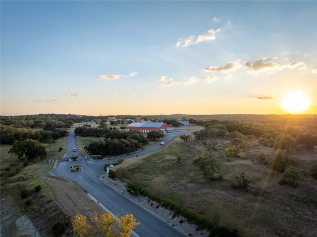 a view of a city with lush green forest