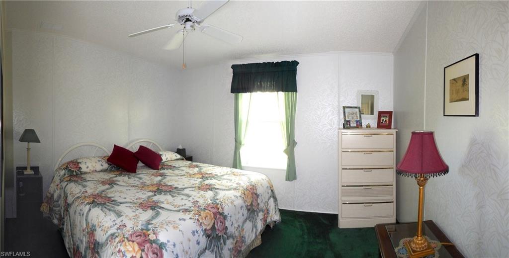 913 Manatee Road Naples, FL 34114 - Photo 8 of 13 a bedroom with a bed and a closet