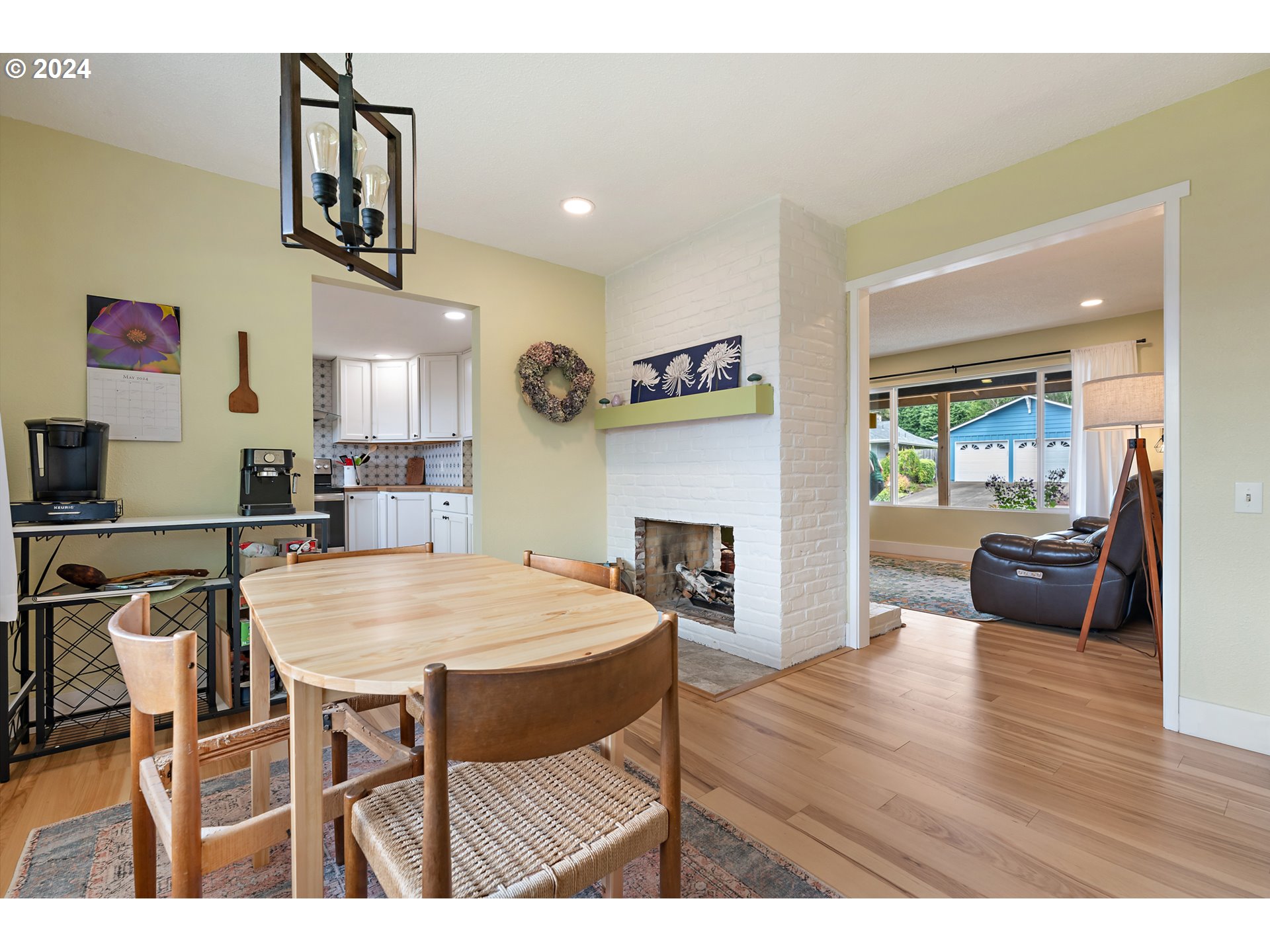16540 Southwest Queen Mary Avenue Portland, OR 97224 - Photo 12 of 30 a view of a dining room with furniture and wooden floor