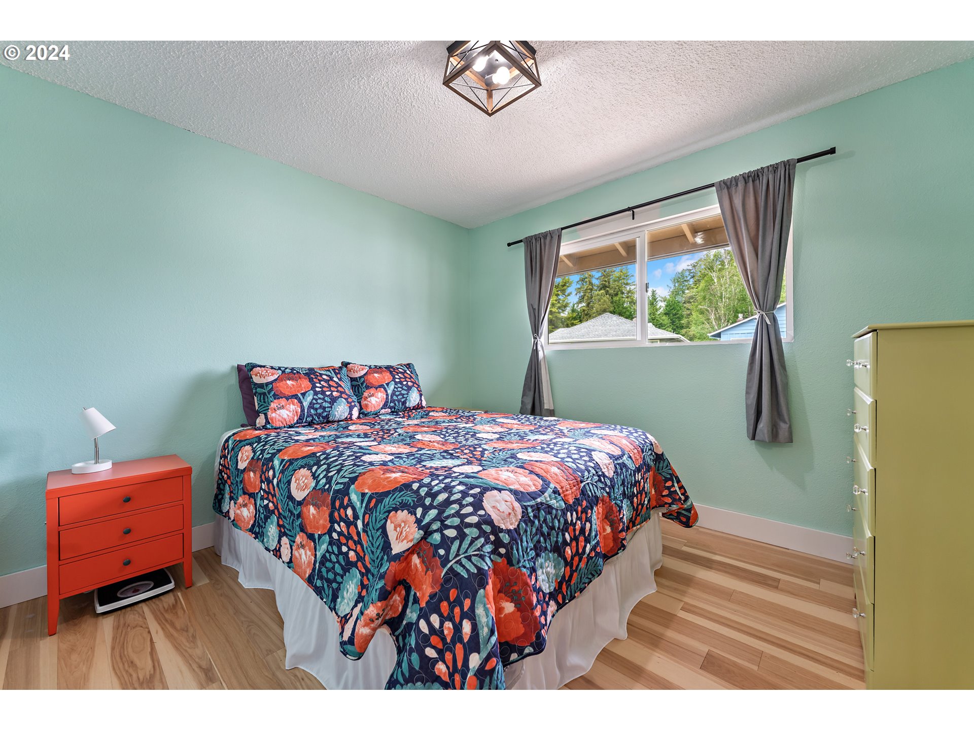 16540 Southwest Queen Mary Avenue Portland, OR 97224 - Photo 17 of 30 a bedroom with a bed and a window