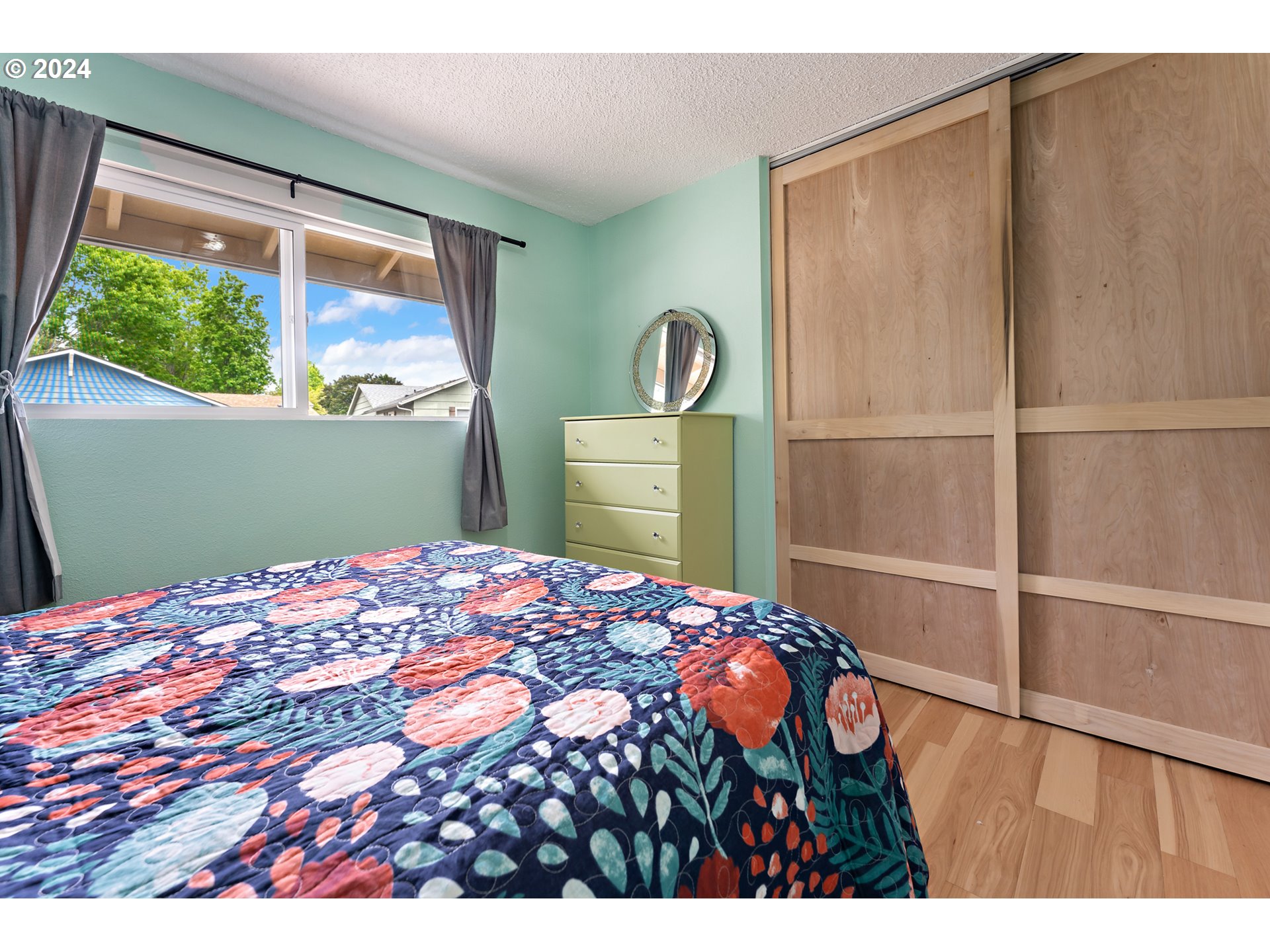 16540 Southwest Queen Mary Avenue Portland, OR 97224 - Photo 18 of 30 a bedroom with a bed and a window