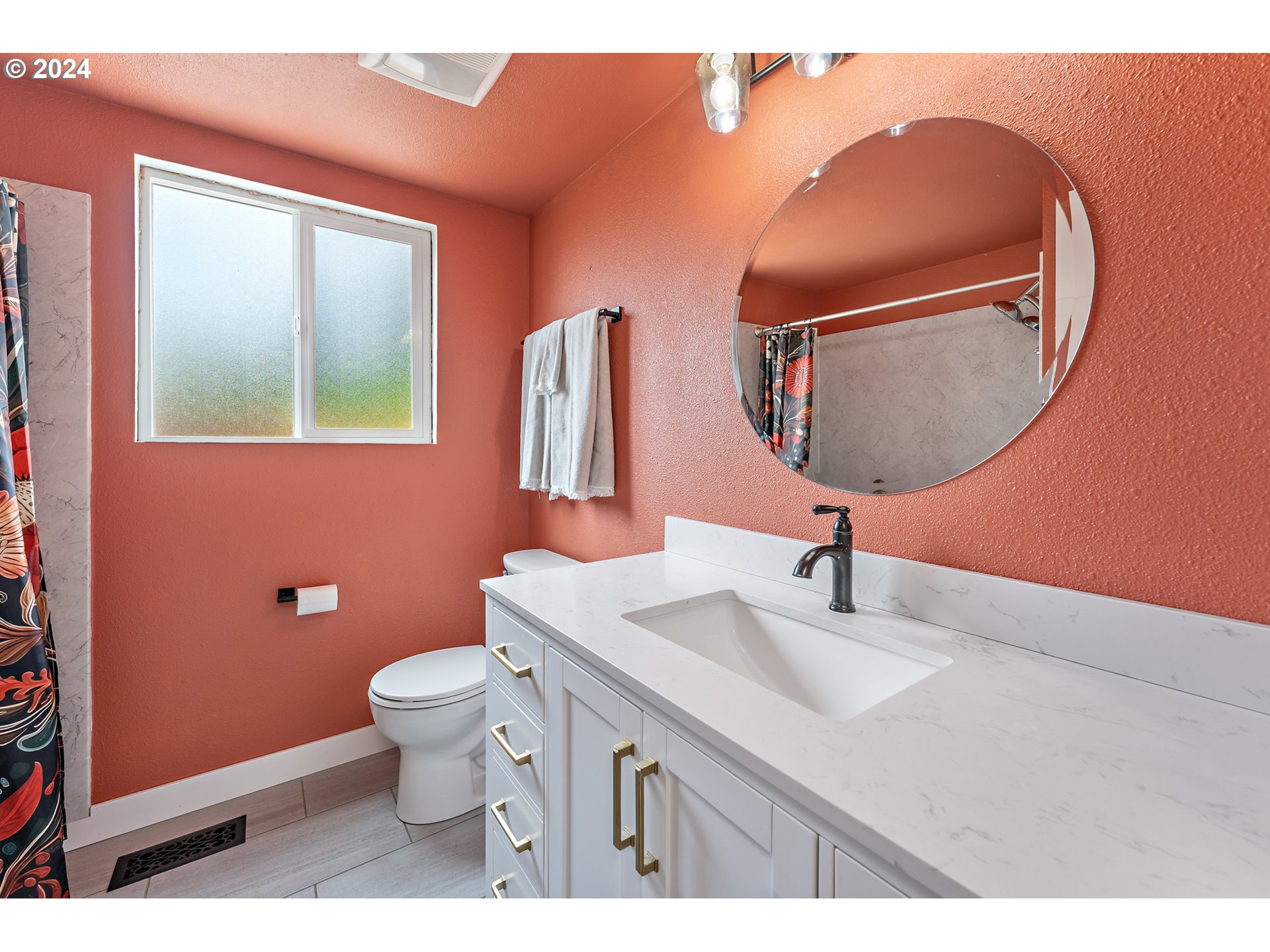16540 Southwest Queen Mary Avenue Portland, OR 97224 - Photo 19 of 30 a bathroom with a sink a toilet and mirror