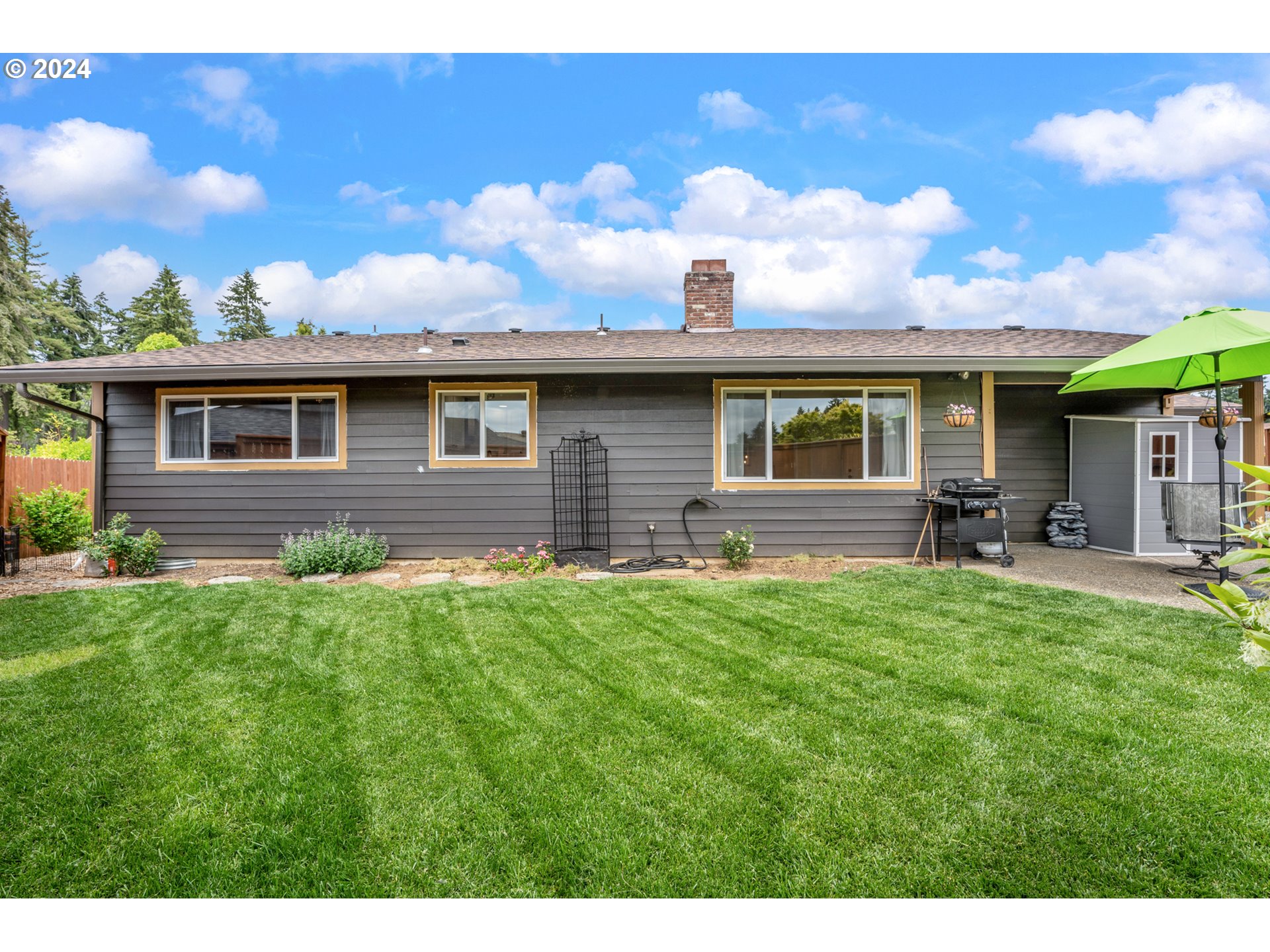 16540 Southwest Queen Mary Avenue Portland, OR 97224 - Photo 26 of 30 a front view of a house with a yard