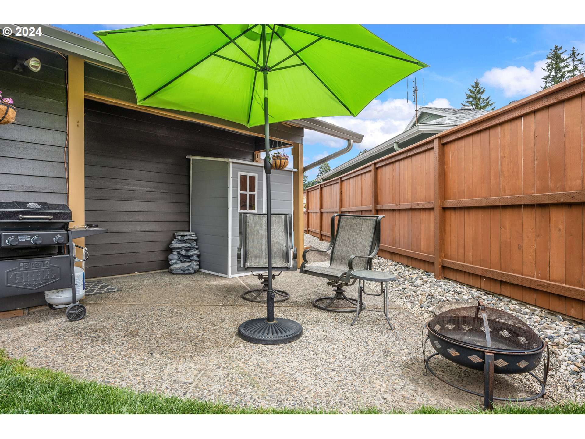 16540 Southwest Queen Mary Avenue Portland, OR 97224 - Photo 28 of 30 an outdoor space with furniture and umbrella