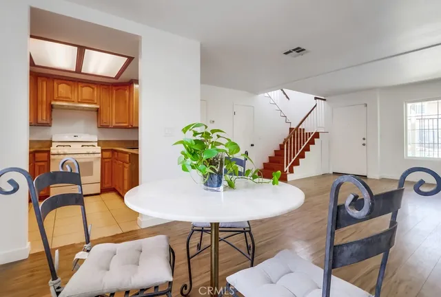 a view of a dining room with furniture and a window