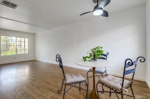 a kitchen with a stove and a white refrigerator