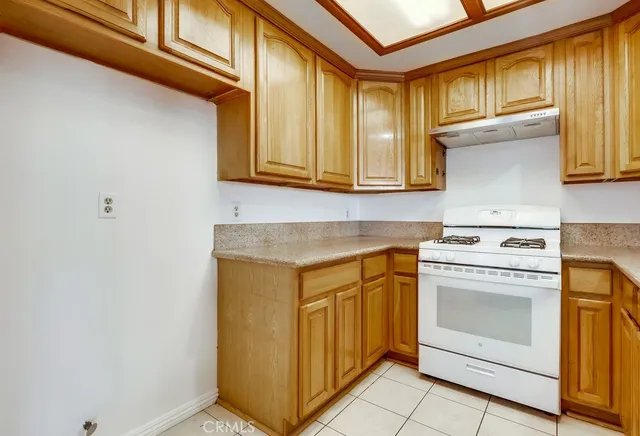 a kitchen with a stove and a sink