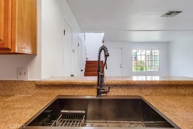 a view of a kitchen from the kitchen