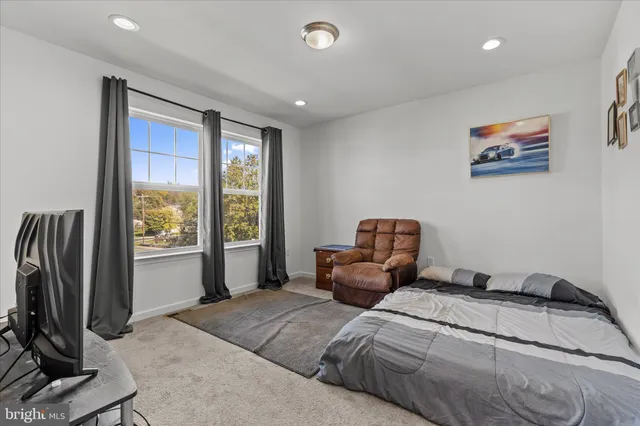 a bedroom with bed and a window
