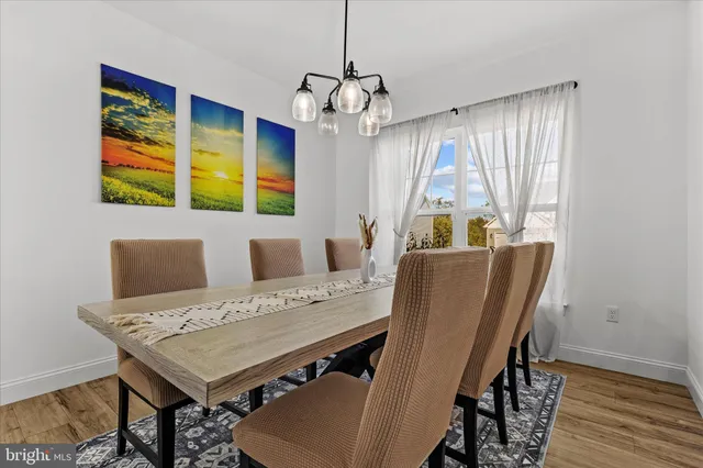 a view of a dining room with furniture and window