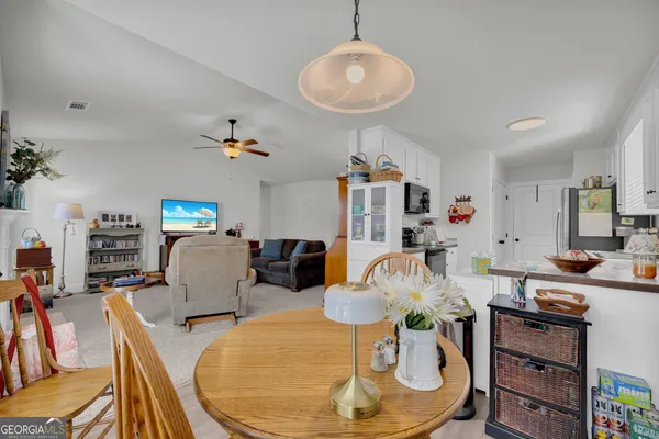 a kitchen with stainless steel appliances a sink dishwasher stove and refrigerator