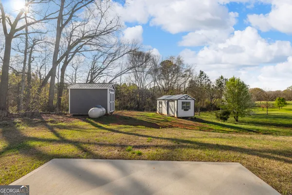 a kitchen with stainless steel appliances granite countertop a sink a stove and cabinets