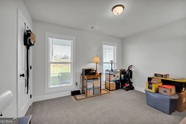 a bedroom with a bed and a walk in closet