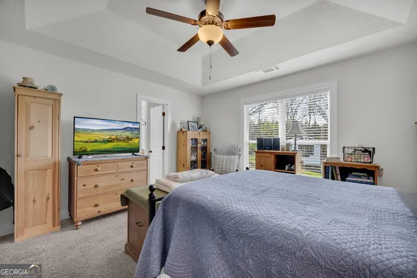 a white bath tub sitting next to a window