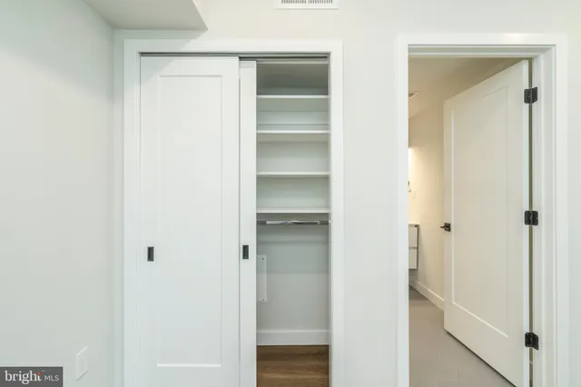 a view of a kitchen with a large window
