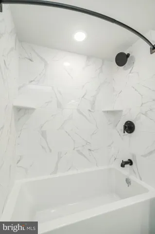 a bathroom with a sink a mirror and vanity