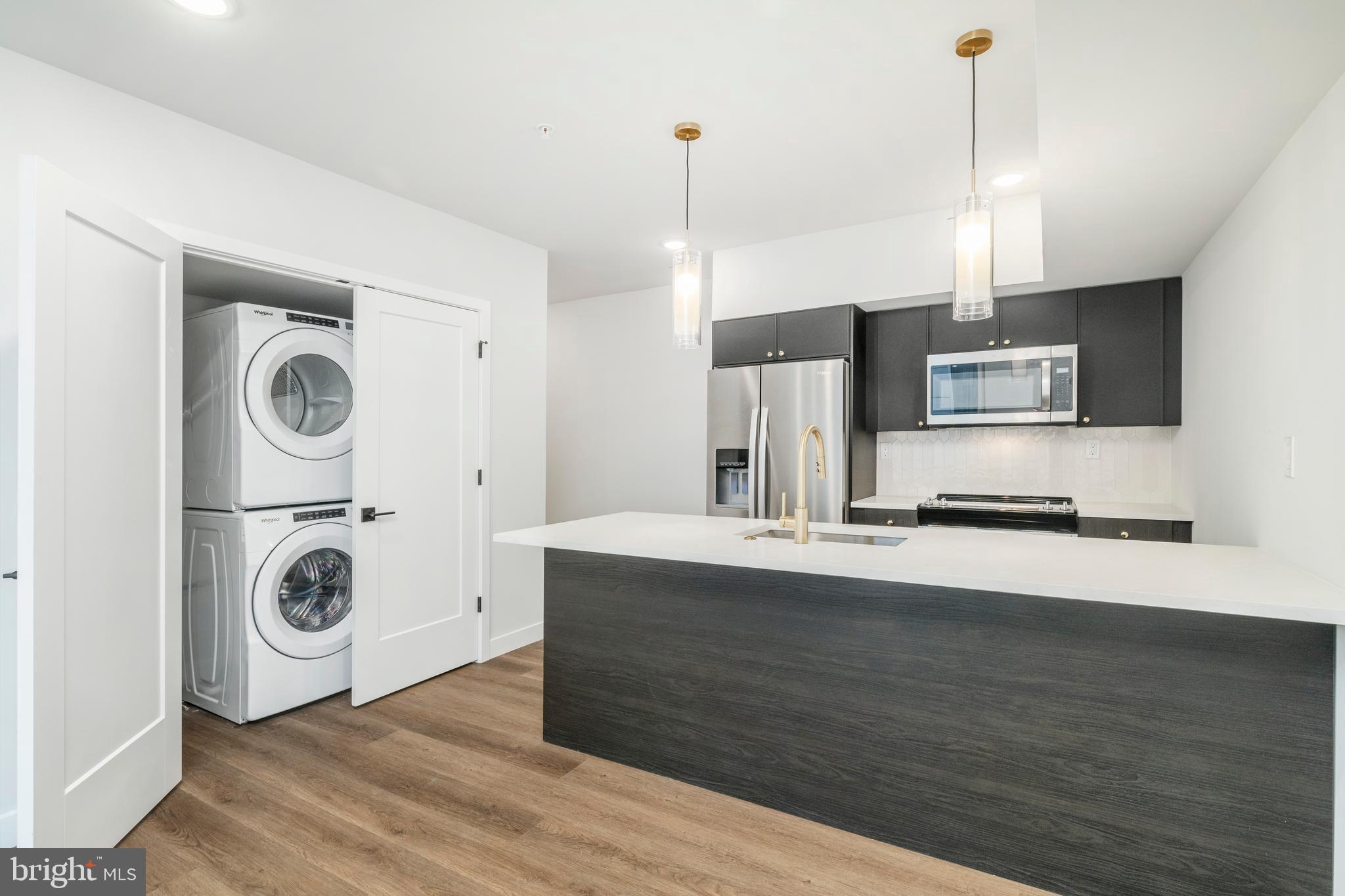 1102 Germantown Avenue, Unit 302 Philadelphia, PA 19123 - Photo 23 of 30 a view of kitchen with stainless steel appliances granite countertop stove top oven and cabinets