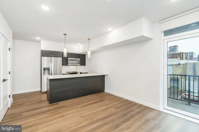 a view of kitchen with wooden floor