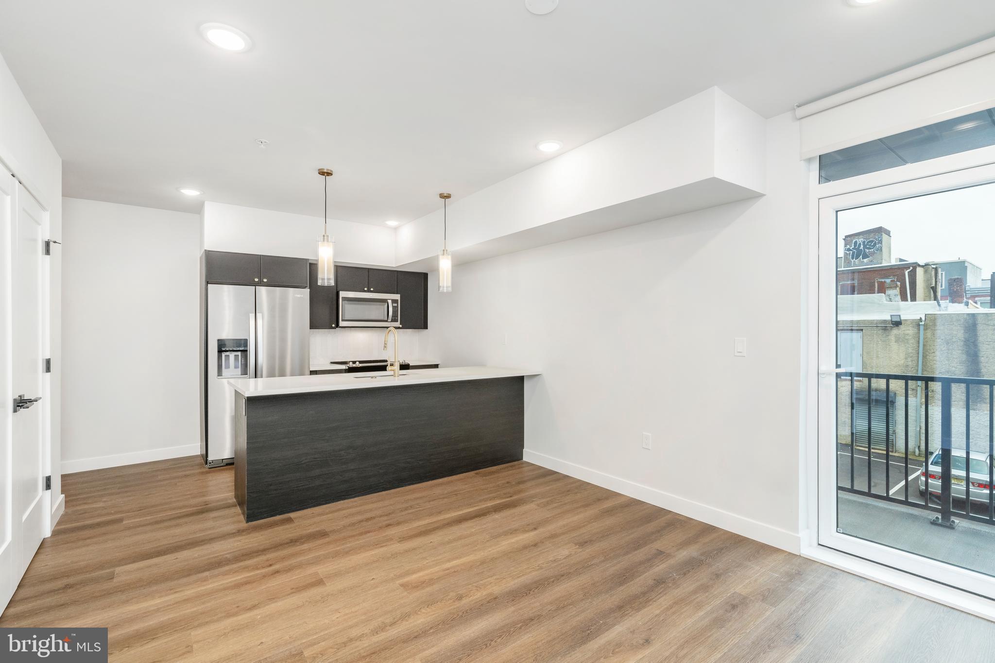 1102 Germantown Avenue, Unit 302 Philadelphia, PA 19123 - Photo 6 of 30 a view of kitchen with wooden floor