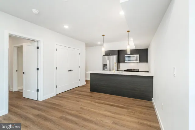 a view of kitchen with wooden floor