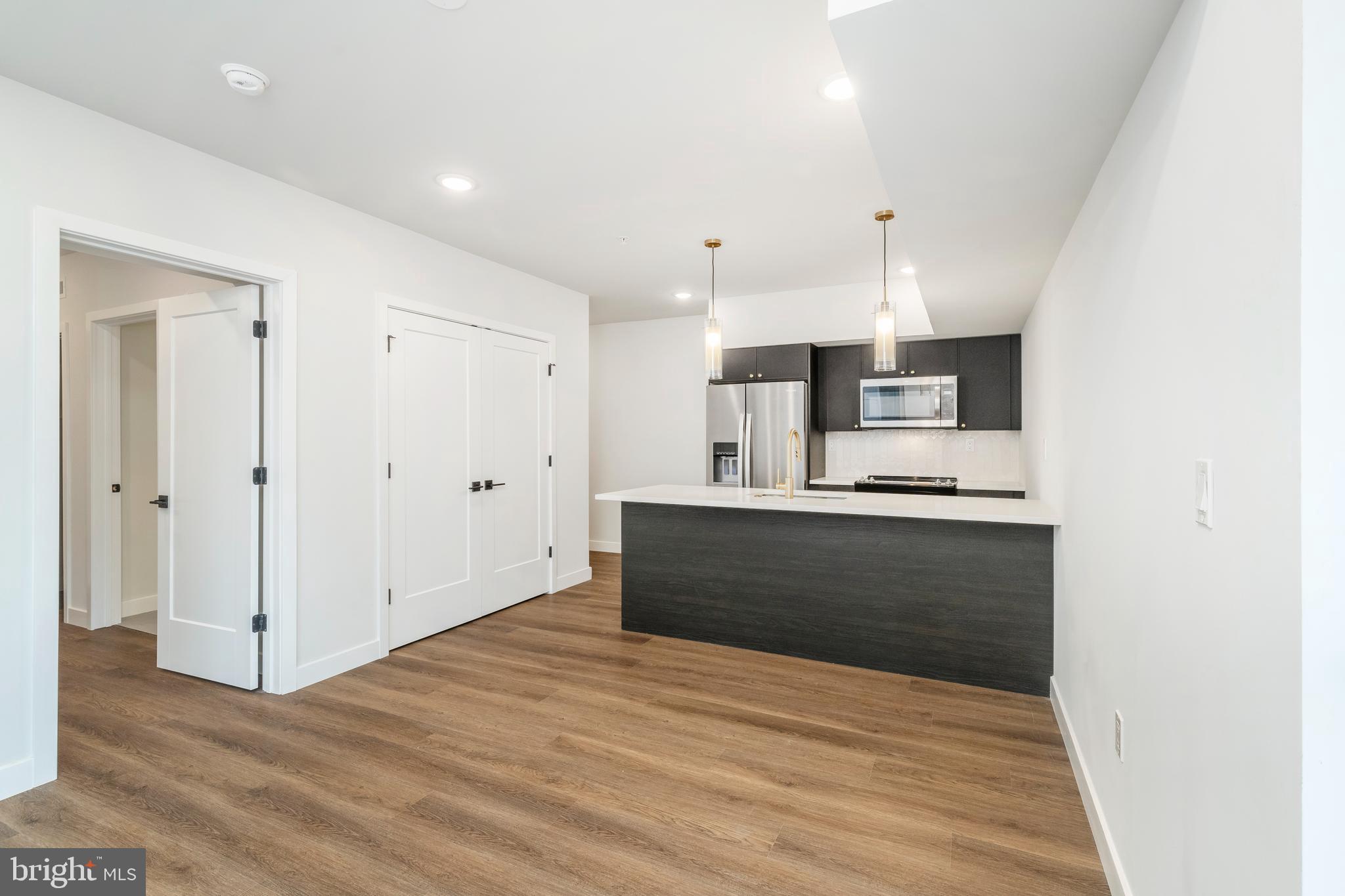 1102 Germantown Avenue, Unit 302 Philadelphia, PA 19123 - Photo 7 of 30 a view of kitchen with wooden floor
